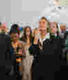Lord Sonny Leong, Mary Portas, and other business leaders listening to speeches at a Westminster event. 